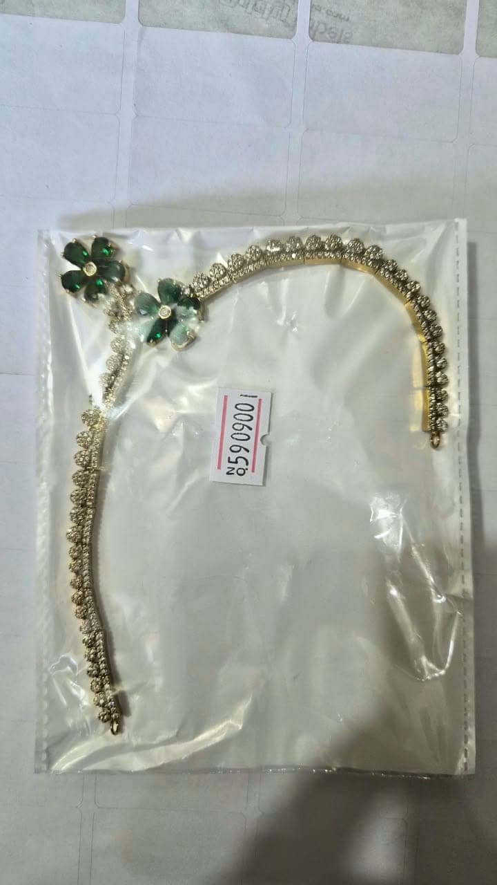 Regal Emerald Green Floral Hairband with Dazzling Stonework & Elegant Gold-Tone Detailing - Jewellery at House of Radhya Kharar