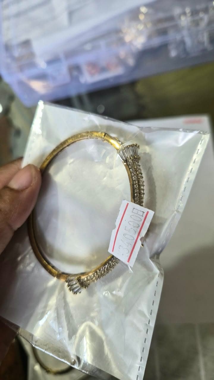 Elegant Gold-Tone Bracelet with Dazzling Crystal & Baguette Stone Embellishments - Jewellery at House of Radhya Kharar